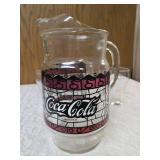 Four Vintage Coco-Cola glasses and Coca-Cola Tiffany-style stained glass Pitcher.
