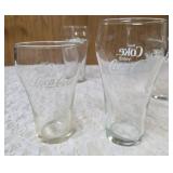 Four Vintage Coco-Cola glasses and Coca-Cola Tiffany-style stained glass Pitcher.