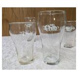 Four Vintage Coco-Cola glasses and Coca-Cola Tiffany-style stained glass Pitcher.