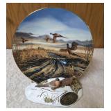 Terry Redland.  Two Terry Redland plate holders  with Two Terry Redland plates. The plates are "Country Road" and "Prairie Skyline".