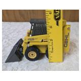 1/25 scale diecast model of a Gehl 4835 skid loader. The brand is Joal and the Manufacturer is Die-Cast Promotions (DCP) or NZG.