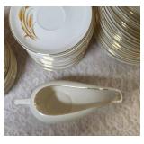 Misc. pieces -20 Dinner plates,12  salad plates, 1 saucer, 1 dessert plate , 1 gravy bowl, 17 coffee plates, 4 bread bowls.  Set of "Homer Laughlin Golden Wheat" dinnerware, featuring 22k gold trim an