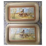 Seven vintage TV dinner trays or snack trays, likely manufactured in the 1950