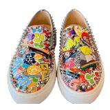 Christian Louboutin Graffiti-Print Studded Slip-On Sneakers - Made in Italy