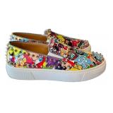 Christian Louboutin Graffiti-Print Studded Slip-On Sneakers - Made in Italy