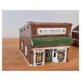 Set of 6 Ceramic Tea Light Houses / Structures by Rice - Ski Jump, Iola Mills, Hobbies Store, Iola Winter Sports Club, Church, House - Each Piece Signed and Authenticated on Bottom