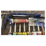 Caulk and caulk guns