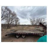 1989 Tandem-axle flatbed equipment trailer