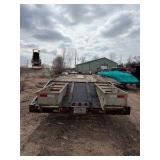 1989 Tandem-axle flatbed equipment trailer