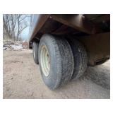 1989 Tandem-axle flatbed equipment trailer