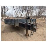 1989 Tandem-axle flatbed equipment trailer