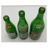 Group Of Vintage Soda Bottles Including 7Up, Mountain Dew, Tab, Coca-Cola And More