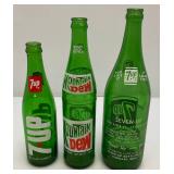 Group Of Vintage Soda Bottles Including 7Up, Mountain Dew, Tab, Coca-Cola And More