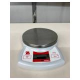Ohaus CS2000 Scale w/ pan & adapter. A portable, easy-to-use digital scale for quick, accurate weighing. Features a stainless steel top, battery power, and simple 2-button control. Great for home 