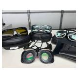Lot of 4 Laser Safety Glasses -premium brands like NoIR & Phillips. These goggles block harmful invisible light, keeping eyes safe during DIY laser work. Features mixed protection levels & cas