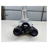 MSRP $1,200 Zeiss 473028 Trinocular Head. This microscope attachment lets you view samples with both eyes while a camera port records images. Perfect for classroom sharing and high-quality photo docum