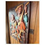 This vintage mid-century modern 3D wall sculpture, titled "Jesters and Clowns" or "Renaissance Minstrels," is a fiberglass art piece by the artist J. Segura
