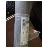 Roll of linoleum, gray wood pattern...