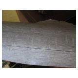 Roll of linoleum, gray wood pattern...