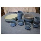 Plastic oval plates, mugs, and serv...