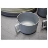 Plastic oval plates, mugs, and serv...