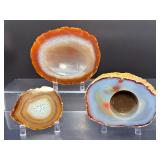Hand-Carved Agate Geode Candle Holder – Vibrant Red & Blue Banding. Polished Agate Trinket Dish – Warm Amber & Cream "Fortification" Agate. Large Brazilian Agate Display Slab – Fiery Ora