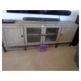 Rustic style entertainment center. As shown. CASH ON SITE ONLY. PICKUP IS MONDAY MAY 11TH FROM 11 AM TO 4 PM. REGARDLESS WHAT THE SCHEDULE STATES.