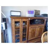 Oak entertainment center. No accessories included. As shown. CASH ON SITE ONLY. PICKUP IS MONDAY MAY 11TH FROM 11 AM TO 4 PM. REGARDLESS WHAT THE SCHEDULE STATES.