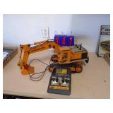 RC excavator digger. Approx 20. As shown. CASH ON SITE ONLY. PICKUP IS MONDAY MAY 11TH FROM 11 AM TO 4 PM. REGARDLESS WHAT THE SCHEDULE STATES.