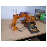 RC excavator digger. Approx 20. As shown. CASH ON SITE ONLY. PICKUP IS MONDAY MAY 11TH FROM 11 AM TO 4 PM. REGARDLESS WHAT THE SCHEDULE STATES.