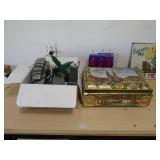 Box of electronics & a tin of electronics. As shown. CASH ON SITE ONLY. PICKUP IS MONDAY MAY 11TH FROM 11 AM TO 4 PM. REGARDLESS WHAT THE SCHEDULE STATES.