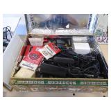 Box of electronics & a tin of electronics. As shown. CASH ON SITE ONLY. PICKUP IS MONDAY MAY 11TH FROM 11 AM TO 4 PM. REGARDLESS WHAT THE SCHEDULE STATES.