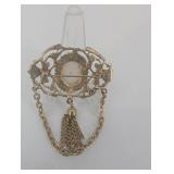 Vintage Gold-Tone Filigree Brooch with Oval Cabochon and Chain Tassels