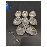 Group of small silver Baskets and olive grabber