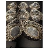 Group of small silver Baskets and olive grabber