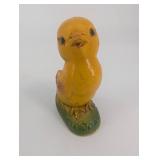 Pair of Yellow Duck Figurines on Leaf-Textured Green Bases