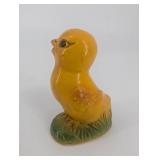 Pair of Yellow Duck Figurines on Leaf-Textured Green Bases