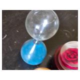 Assorted Collectible Items Including Hourglass, Stone Arrow Points, and Decorative Pieces