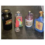 Baileys Irish Cream Tin, Beams Choice Whiskey Bottle, Jug Wine Bottle, and 1800 Tequila Bottle