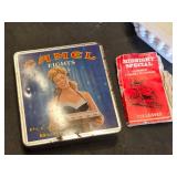 Assorted Smoking Accessories including Camel Lights Tin, Midnight Special Papers, and Ashtrays