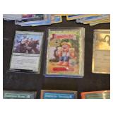Various Collectibles and Trading Cards including Power Rangers Mystic Cycle Blasters, The Simpsons Comics, and PokÃ©mon Cards
