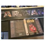Star Wars Memorabilia Collection including Posters, Plaques, and Book Cover