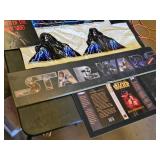 Star Wars Memorabilia Collection including Posters, Plaques, and Book Cover