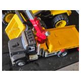 Toy Construction Vehicles Including Dump Truck, Front Loader, and Crane Truck