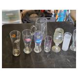 Variety of Glassware and Pitcher Collection Including Bubba Gump and Blue Moon Glasses