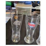 Variety of Glassware and Pitcher Collection Including Bubba Gump and Blue Moon Glasses