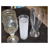 Variety of Glassware and Pitcher Collection Including Bubba Gump and Blue Moon Glasses