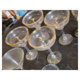 Various Glasses, Some Plastic and Goblets Including Skeleton Hand Stand and Bullet Embedded Tumblers