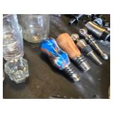Assorted Bar Accessories including Disaronno Ice Buckets, Shot Glasses, and Wine Stoppers