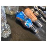 Assorted Bar Accessories including Disaronno Ice Buckets, Shot Glasses, and Wine Stoppers